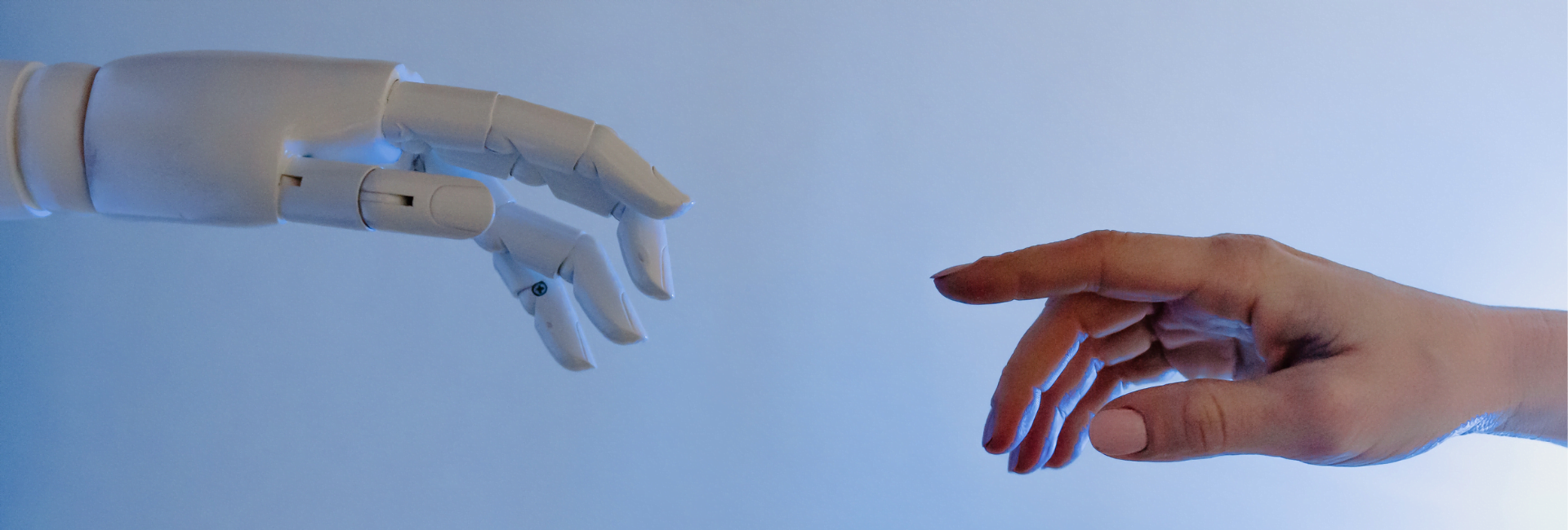 Robot and Human hand on a blue background symbolising the use of AI