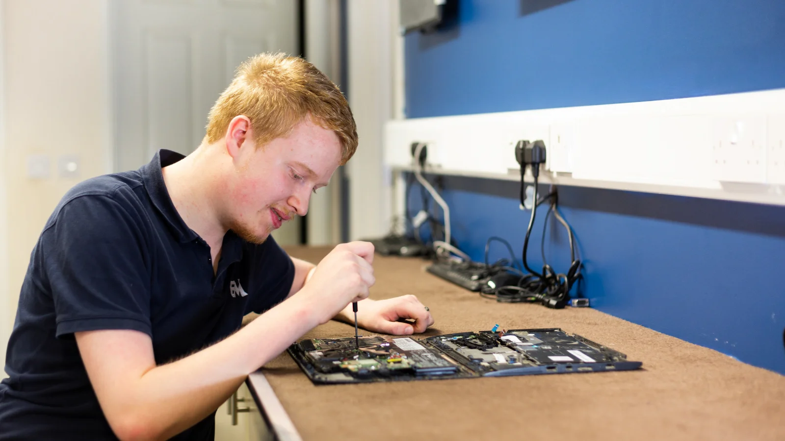 IT Technician working on a device