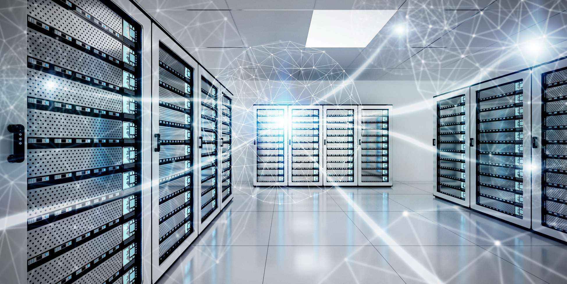 Modern data centre featuring multiple server racks with illuminated panels and a high-tech environment, showcasing advanced technology infrastructure.